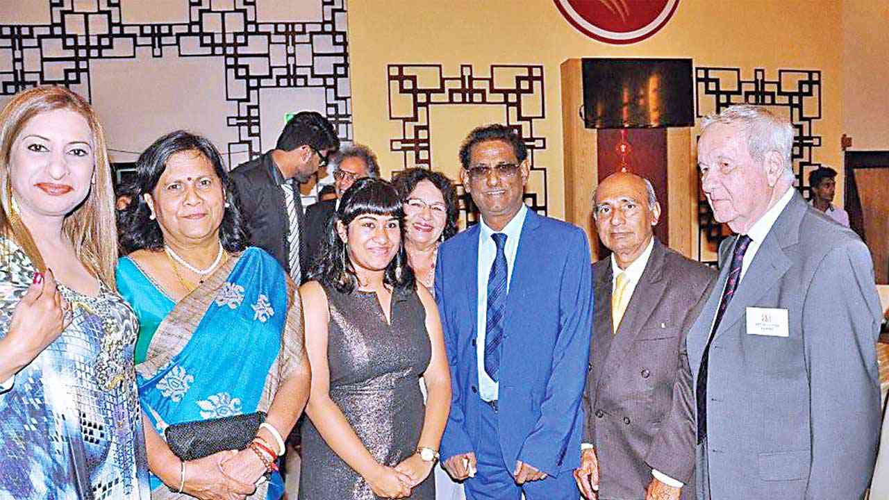 Miss Kayseka Geerjanan,  winner of the Magna Carta  International Creative Writing  Competition for the African  Continent, with the Chief Guests.