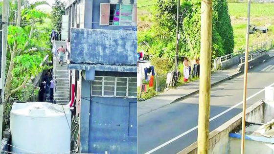 À Quartier-Militaire : les travailleurs étrangers prennent leur bain en plein air