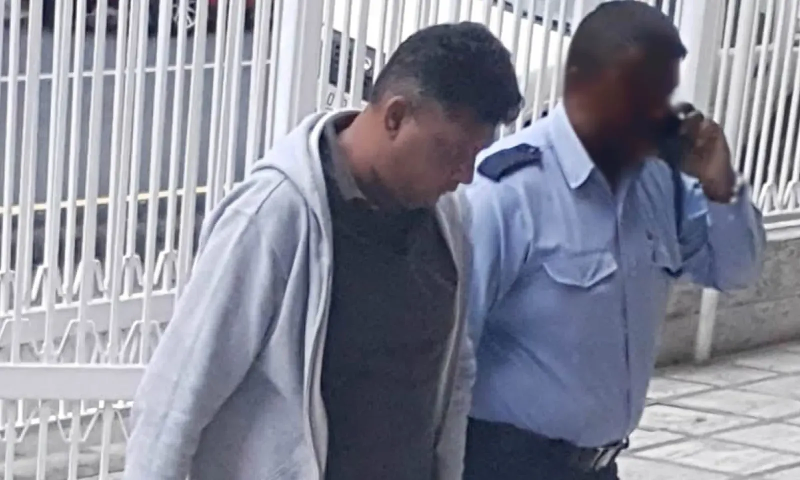 Le policier lors de sa comparution devant la BRC samedi pour extorsion.