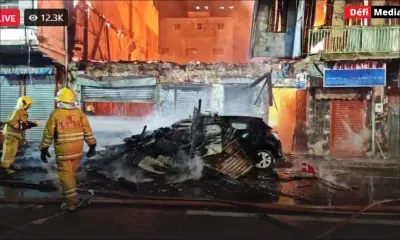 Incendie à la rue Royale : une partie du bâtiment en flammes s’effondre sur une voiture