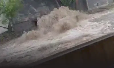 Alerte aux fortes pluies : un ruisseau inondé à Bell-Village