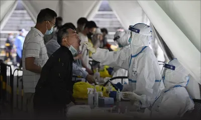 Covid-19: Pékin étend le dépistage, le confinement menace