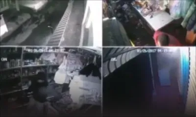 Un boutiquier aux prises avec son agresseur dans une vidéo surveillance