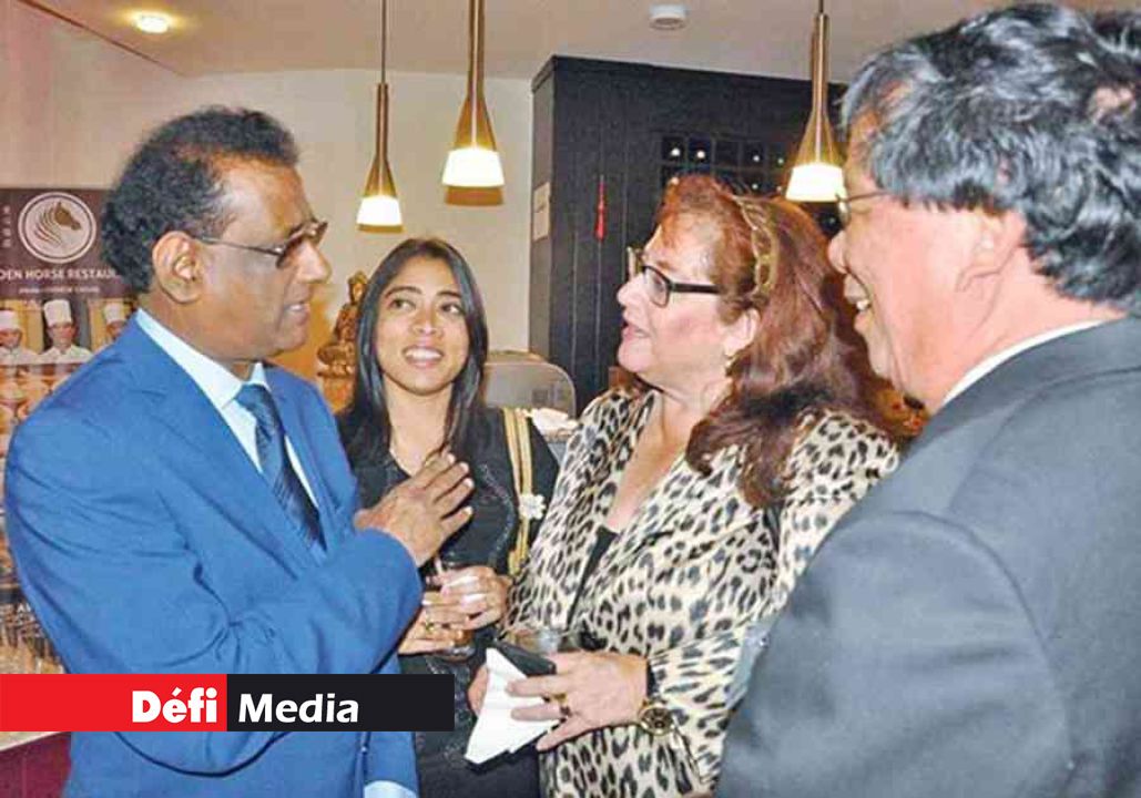 H.E. the Vice President chatting with Mrs Tedde Thompson, Public Affairs Officer of the US Embassy and other guests. H.E. the Vice President chatting with Mrs Tedde Thompson, Public Affairs Officer of the US Embassy and other guests.